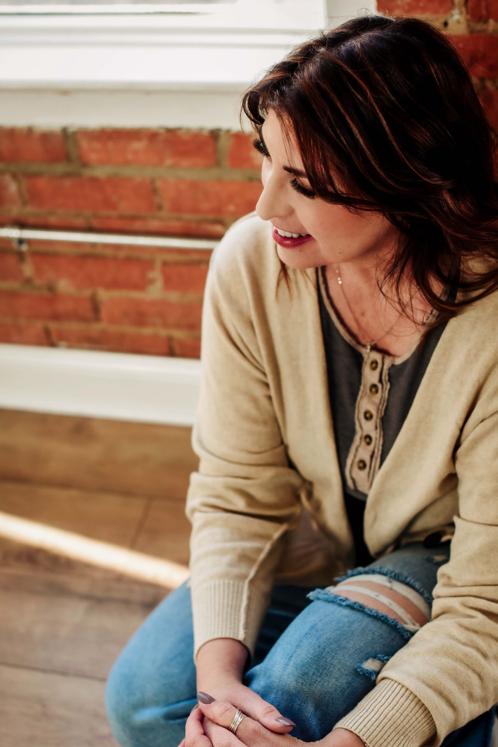 Jan Touchberry sitting thoughtfully in casual clothes, representing her faith-driven approach to Christian entrepreneurship