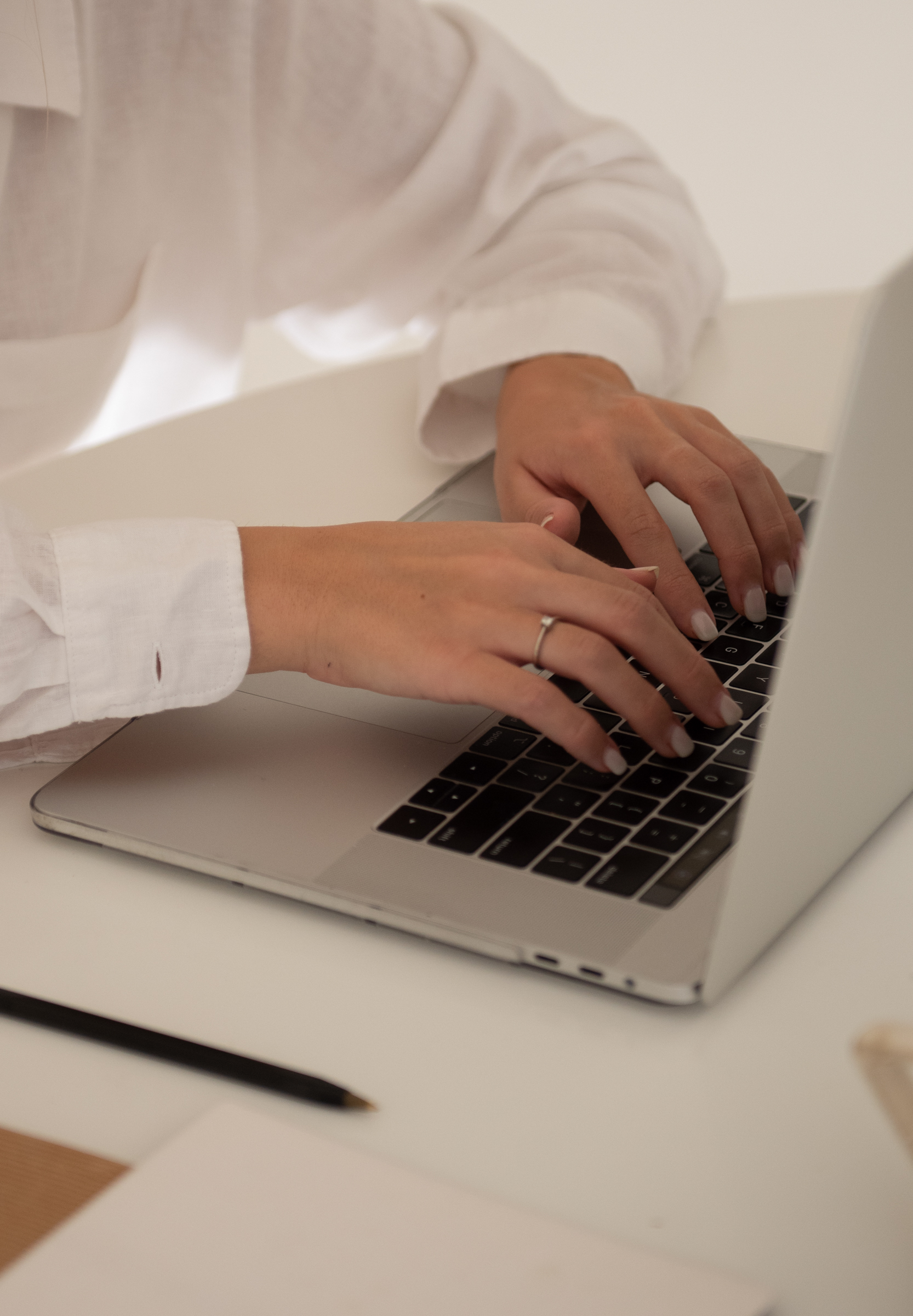 Woman typing on a laptop, checking if her marketing is working